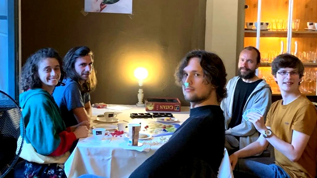 Table with people at after-Mass fellowship